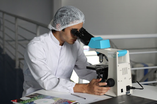 Psychology Revision and Notes Research Methods Scientist looking in a Microscope Vaia 